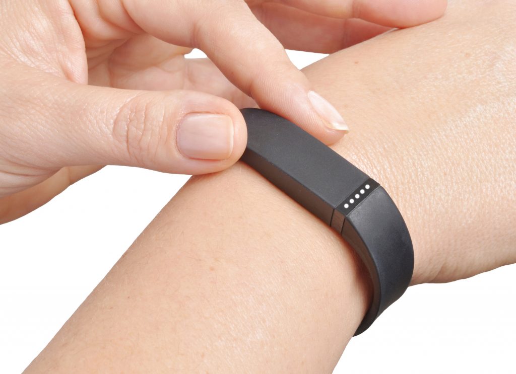 35197235 - activity tracker on a woman's wrist