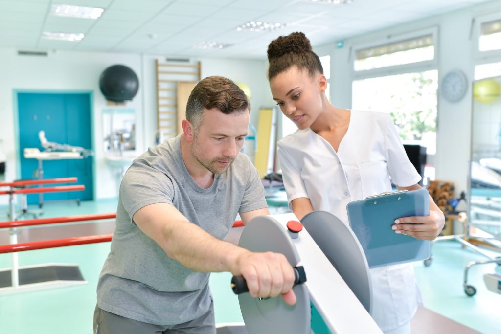 Physical therapist helping a patient with their exercise.